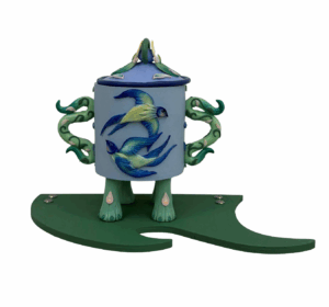 Colourful bottle by artist Hannah Lim decorated with two circling swallows on a blue background